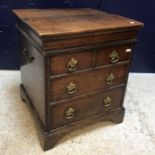 A 19th Century oak portable commode in the 17th Century style,