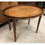 An Edwardian mahogany and inlaid "The Osterley" table tray on square tapered legs,