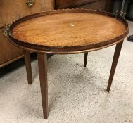 An Edwardian mahogany and inlaid "The Osterley" table tray on square tapered legs,