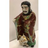 A 19th Century Chinese porcelain polychrome decorated figure as a curly haired gentleman with beard