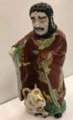 A 19th Century Chinese porcelain polychrome decorated figure as a curly haired gentleman with beard