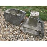 A composite stone bird bath in two pieces