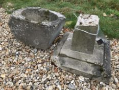 A composite stone bird bath in two pieces