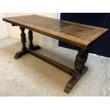 A 20th Century oak refectory style dining table in the 17th Century manner,