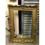 Gilt picture frame with shell decoration to corners and floral decoration to the edges - internal