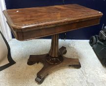 A Victorian mahogany fold-over card table, the rectangular top with moulded edge,