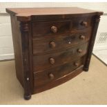 A 19th Century Victorian bow fronted chest of two short over three long graduated drawers flanked