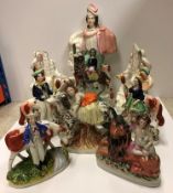 A collection of nine various 19th Century Staffordshire figures including hunter with rifle and