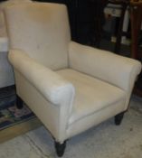 A Victorian upholstered scroll arm chair on turned and ringed front legs stamped "C V S" to back