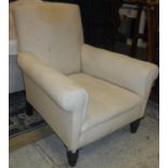 A Victorian upholstered scroll arm chair on turned and ringed front legs stamped "C V S" to back