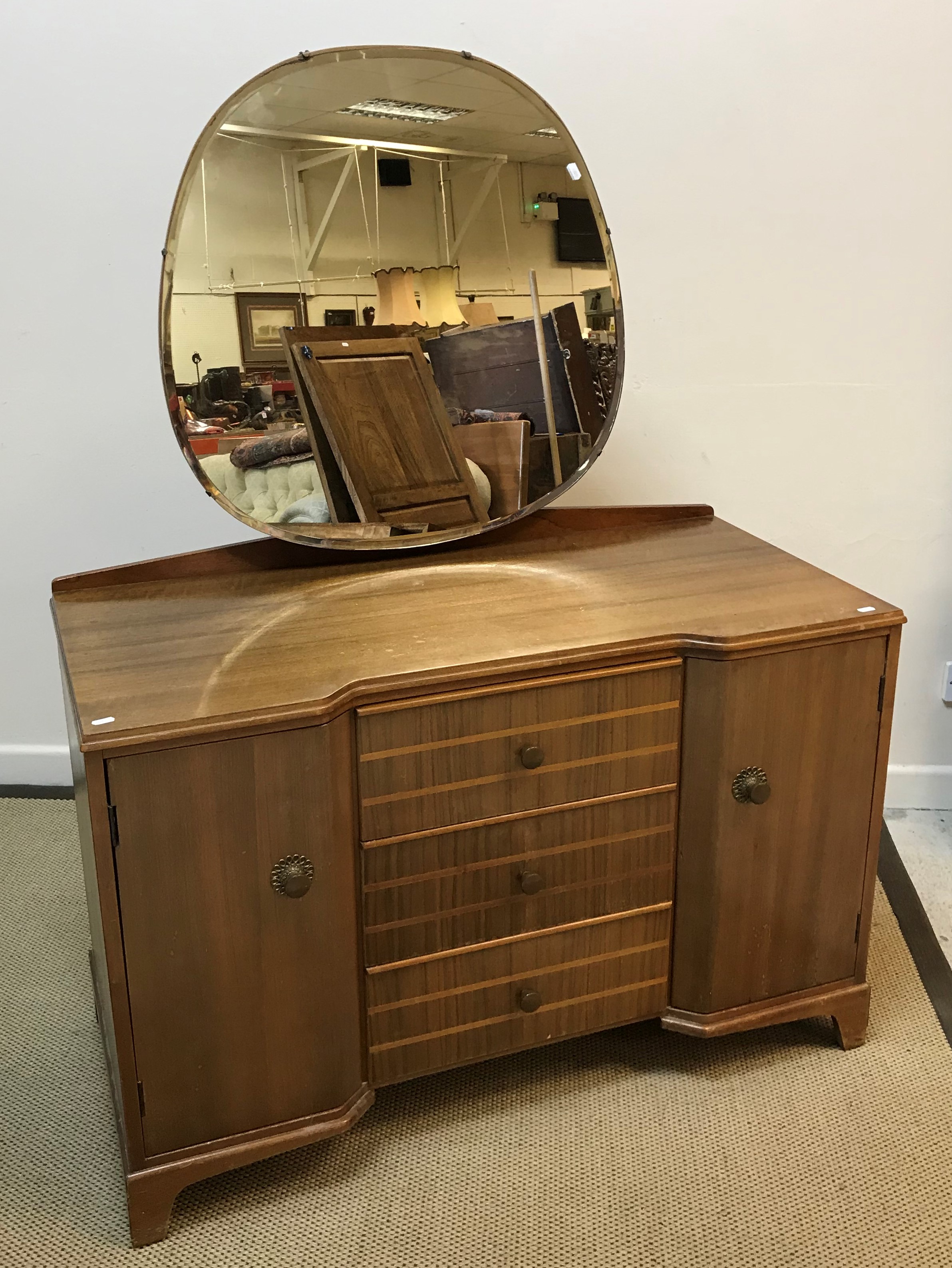 A mahogany dressing chest with three drawers flanked by two cupboard doors with circular mirror, - Image 3 of 3