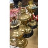 Three various Victorian brass oil lamps 44.5 cm high, 39 cm high and 31.