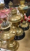 Three various Victorian brass oil lamps 44.5 cm high, 39 cm high and 31.