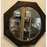 A Liberty style beaten copper octagonal wall mirror with central bevel edge plate,