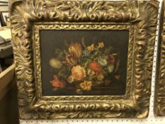 A pair of decorative prints in the Dutch style, housed in 19th Century style gilt frames,