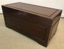 An Eastern camphor wood trunk of plain form 94 cm x 46 cm x 45 cm high together with a tin lined