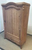 A Continental pine armoire of small proportions,