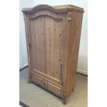 A Continental pine armoire of small proportions,