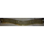 An early 19th Century pierced brass serpentine fire fender 125 cm wide x 17 cm high