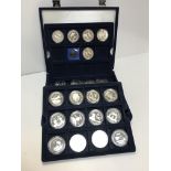 A Westminster blue velvet effect cased box containing 22 commemorative five-pound coins,