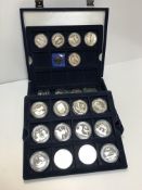 A Westminster blue velvet effect cased box containing 22 commemorative five-pound coins,