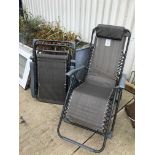 A pair of folding garden chairs