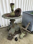 A late 19th Century cast iron fountain with central cherub support, raised on a base of three swans,