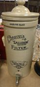 A stoneware water filter inscribed "Cheavin's Saludor (Safe Water) Filter - drinking water of