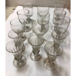 A collection of fourteen various 19th Century English drinking glasses including rummers,