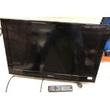 A Samsung model LE32C450E1W colour television with remote control