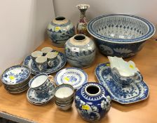 A collection of Chinese pottery and porcelain to include a blue and white sauceboat decorated with