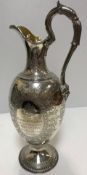 A Victorian engraved silver presentation claret jug inscribed "… To George M Cardew Captain and