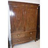 A 19th Century mahogany and satinwood strung linen press,