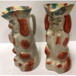 A pair of 19th Century Staffordshire "Brown and white Spaniels" as jugs in tricorn hats, 22.