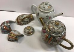 An 18th Century Chinese polychrome decorated bullet shaped teapot and cover,