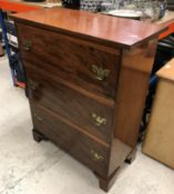 A 19th Century mahogany chest, the plain top above three long graduated drawers on bracket feet,