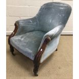 A Victorian mahogany framed upholstered armchair with acanthus carved show frame arms on turned and