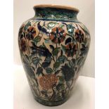 A 1930's Palestine faience glazed terracotta vase with all-over floral decoration in the Iznic