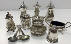 A modern silver three-piece cruet comprising lidded mustard with spoon,