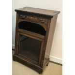 A Victorian rosewood and marquetry inlaid music cabinet with single drawer over a recess and glazed