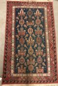 A Kelim style rug, the central panel set with geometric design on a blue ground,
