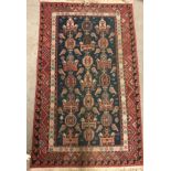 A Kelim style rug, the central panel set with geometric design on a blue ground,