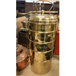 An Indian brass five section cylinder tiffin box each section with Indian script to the sides