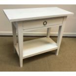 A Lombok painted two drawer side table on square tapered legs united by an under tier 120 cm x 44.