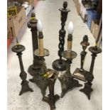 A collection of eight various table lights including two faux candlestands on dragon decorated