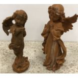 A cast iron figure of a praying angel 31 cm and a cast iron figure of a cherub with butterfly on