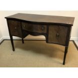 A mahogany serpentine fronted sideboard in the Georgian style,