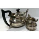 A George V silver teapot and matching milk jug with gadrooned edge (by George Nathan and Ridley