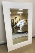A Lombok white painted hardwood framed rectangular wall mirror with bevel edged plate,