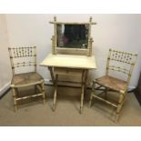 A painted faux bamboo framed dressing table with raised mirror back over a single drawer on an X